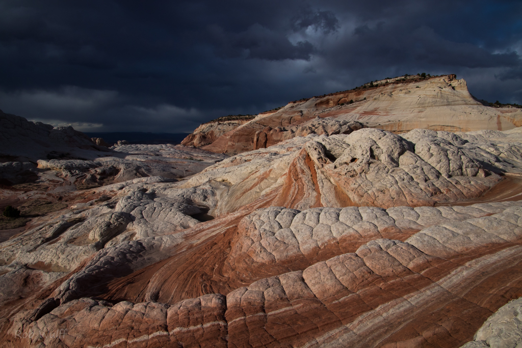landscape photography of White Pocket with a stormy sky